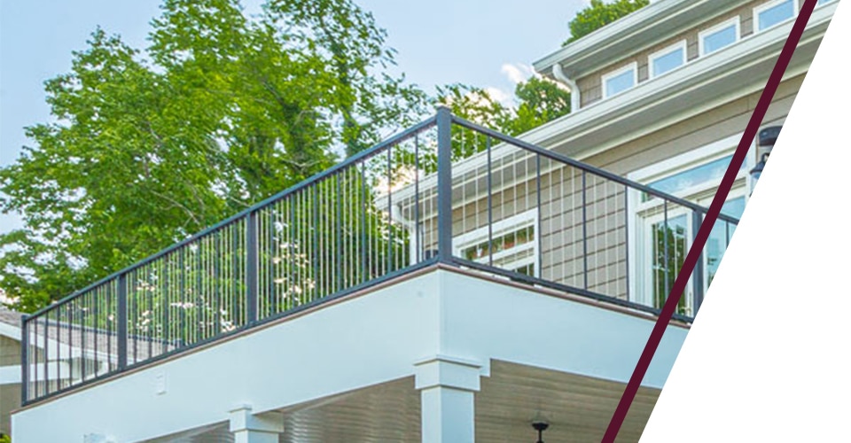 Deck attached to a house utilizing the VertiCable system